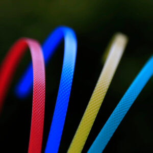 Colorful 5mm PP strapping bands in blue, white, yellow, green, and red for lightweight packaging applications
