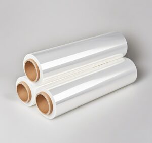 Three clear stretch film Wrapping Roll stacked in a triangular arrangement on a neutral background.