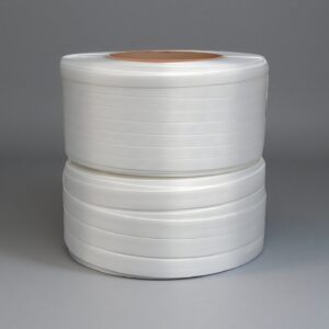 Rolls of white composite cord strapping for heavy-duty load securing.
